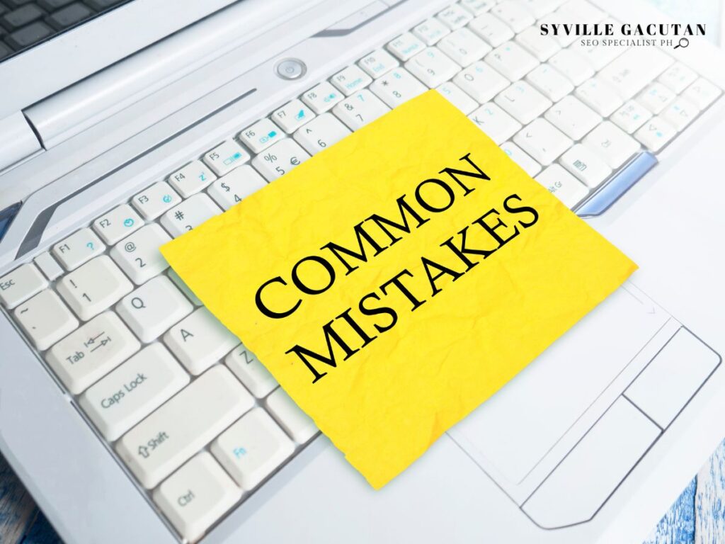 Yellow sticky note reading "COMMON MISTAKES" placed on a white computer keyboard.