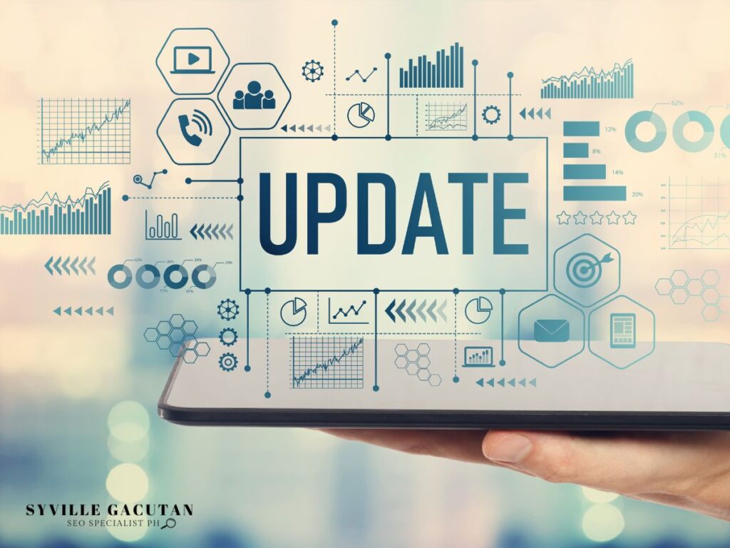 "Update" text surrounded by analytics icons displayed on a tablet held by a hand.