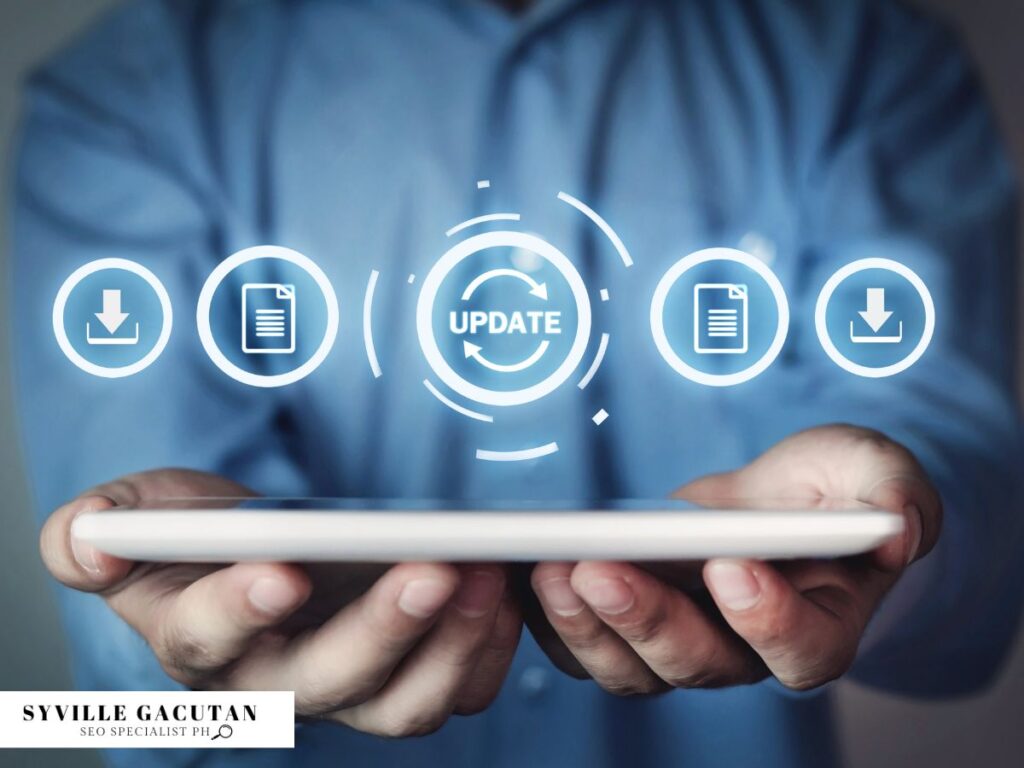 Hands holding a tablet with a glowing "Update" icon.