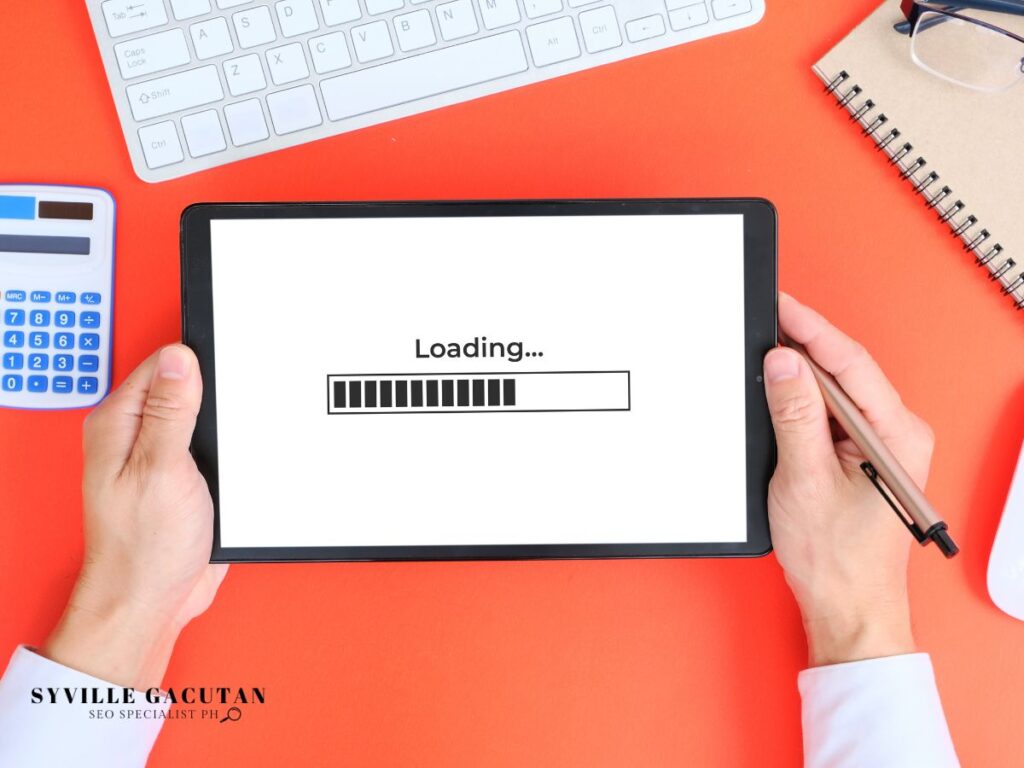 A tablet displaying a "Loading..." bar held by a person.