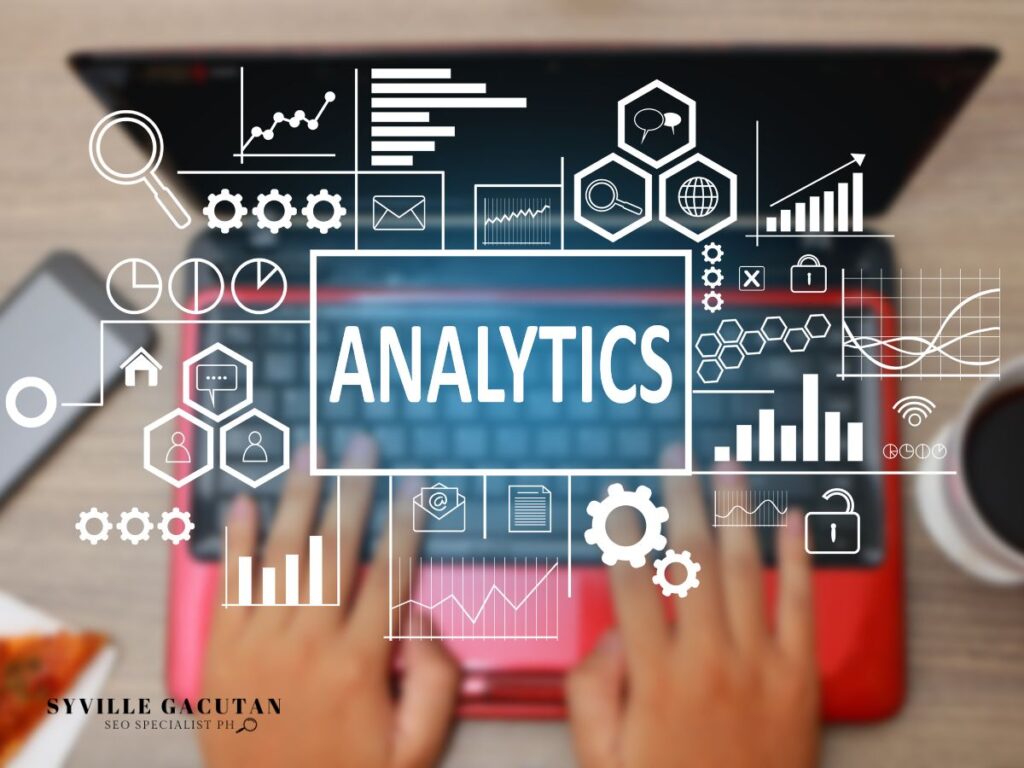 Laptop with "Analytics" surrounded by digital data icons.