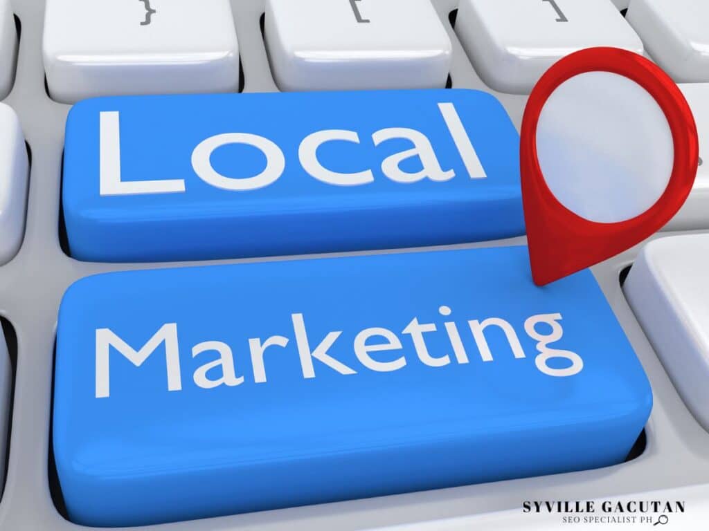 Red location pin on blue "Local Marketing" keyboard keys.