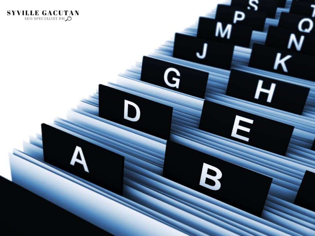 Alphabetized file folders with tabs showing letters, indicating organization.