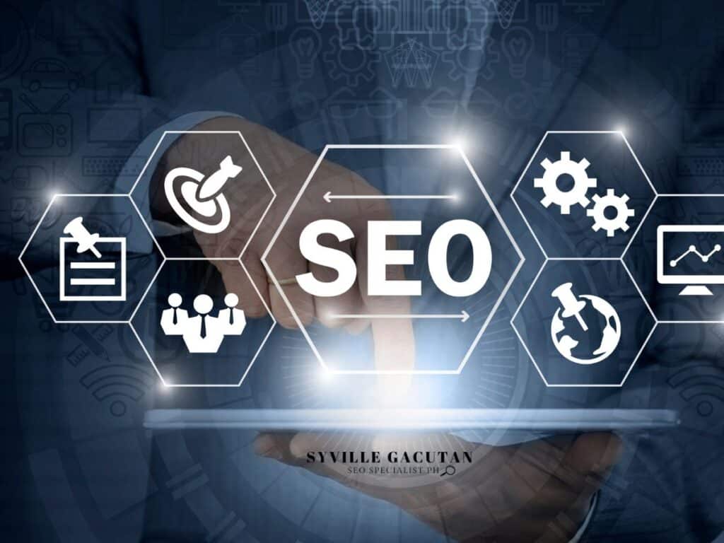 Hand touching SEO icons, including gears and graph symbols.