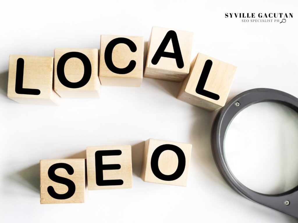 Wooden blocks spelling "Local SEO" next to a magnifying glass.