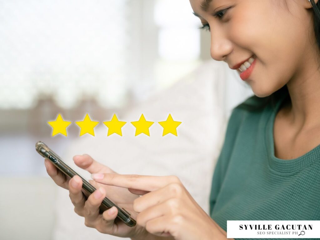 Woman smiling while rating on her phone with five stars visible.