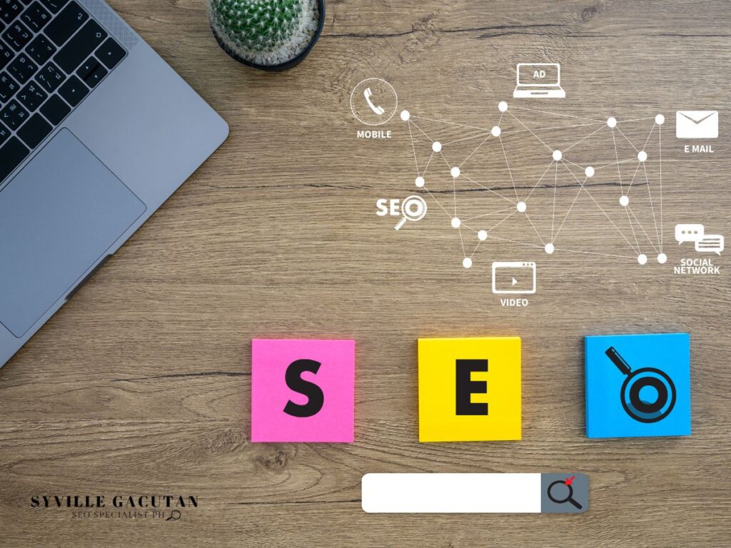 SEO network diagram with laptop and colorful sticky notes spelling "SEO" on wooden desk.