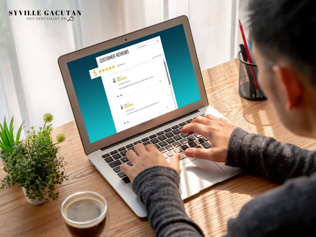 Laptop screen showing customer reviews with a coffee nearby.