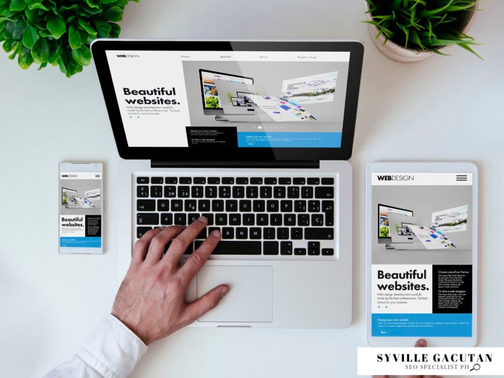 Hand using a laptop showcasing "Beautiful websites" text.