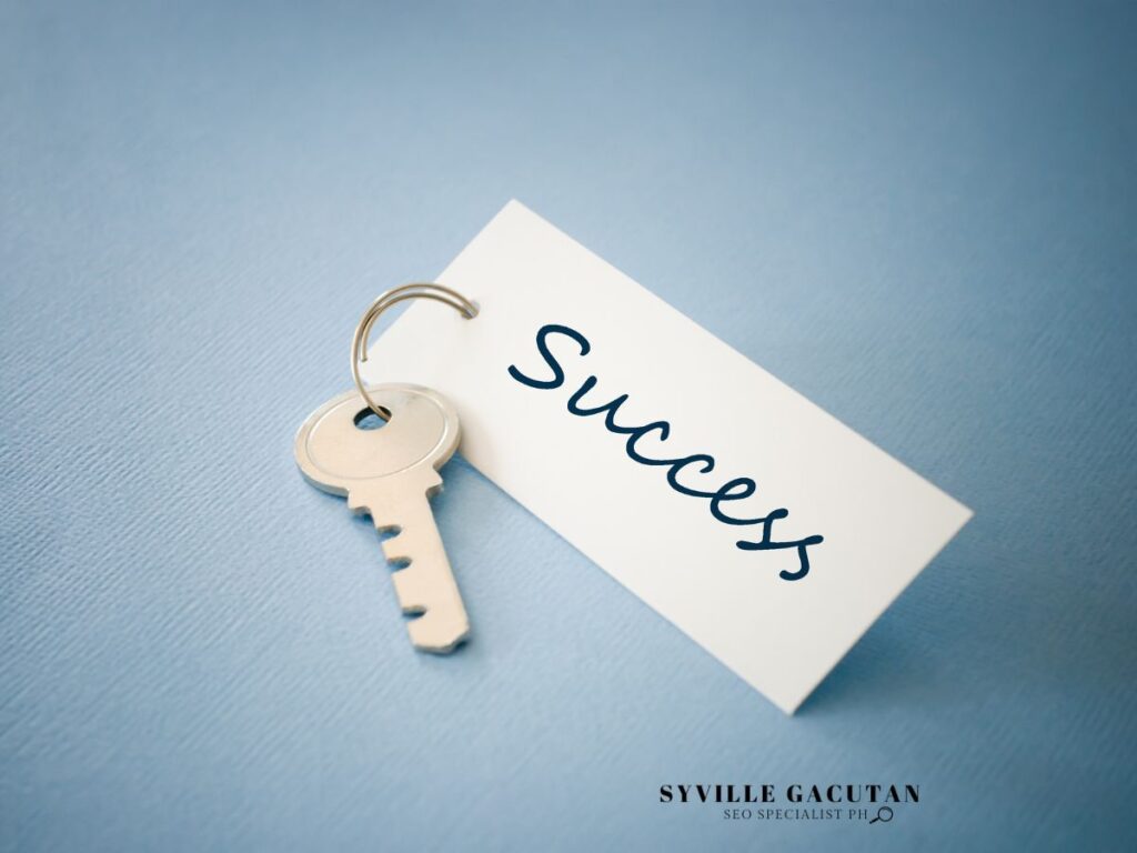  Key with a tag labeled "Success" on a light blue background.