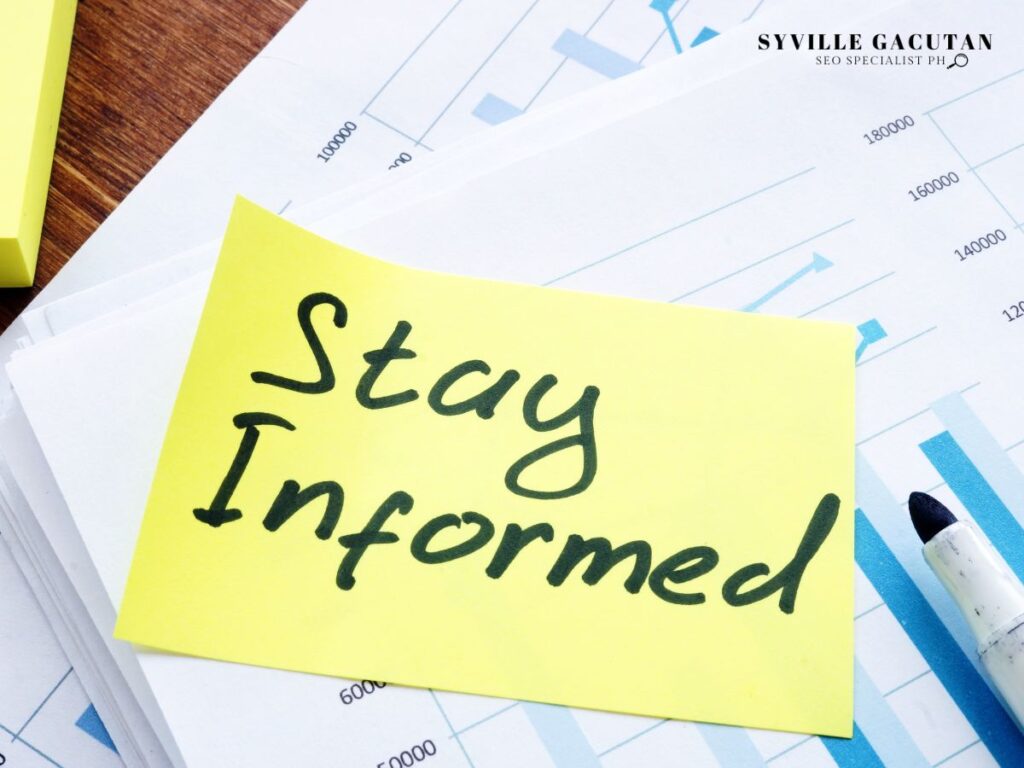 Sticky note reading "Stay Informed" on analytics charts.