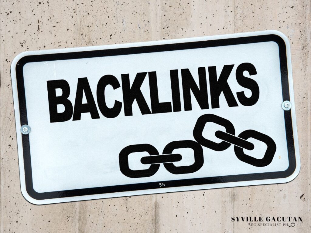 A sign labeled "Backlinks" with chain links illustration.