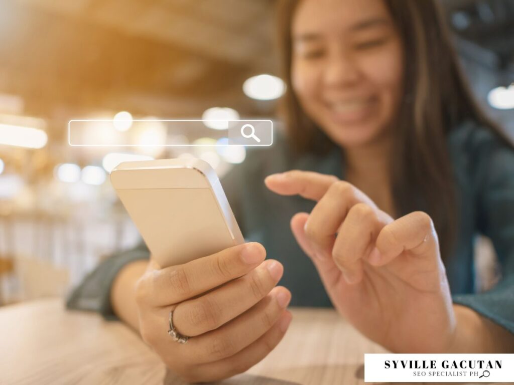 Woman smiling at her phone with a search bar overlayed