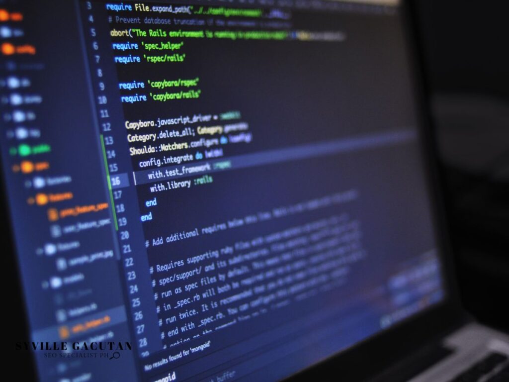 Close-up of coding lines on a laptop screen in a dark setting