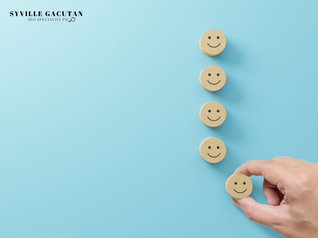 Wooden smiley faces aligned on a blue background.