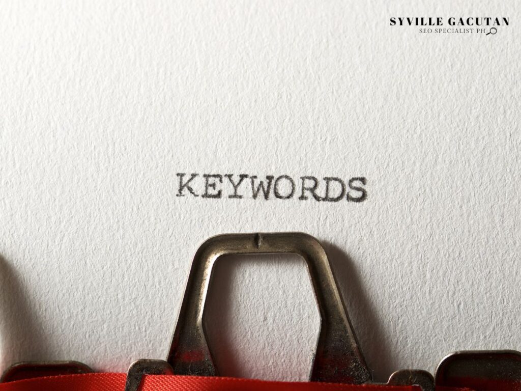 The word "KEYWORDS" typed on paper with a vintage typewriter.