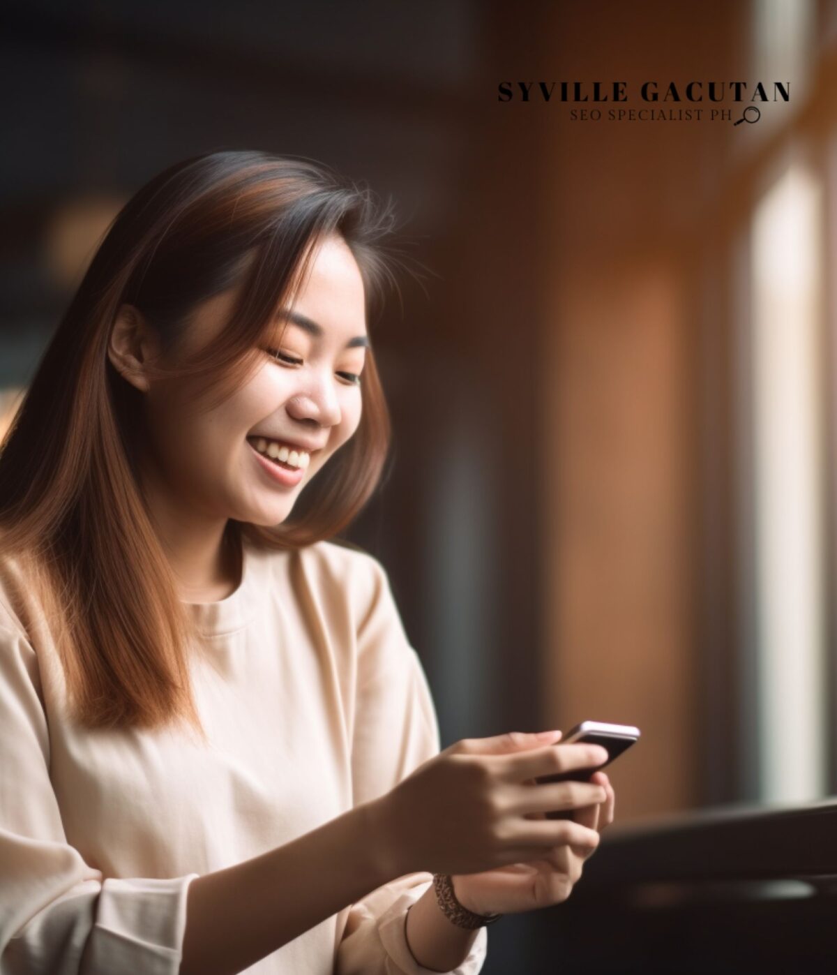Smiling woman looking at her phone in a warmly lit room.