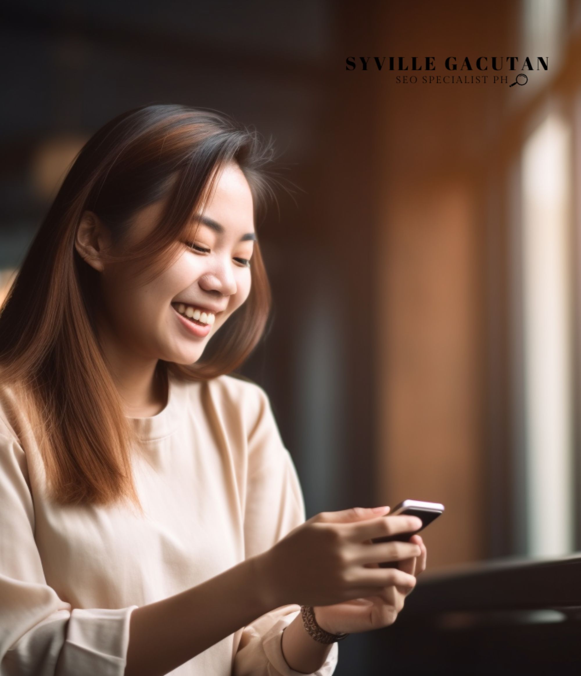 Smiling woman looking at her phone in a warmly lit room.