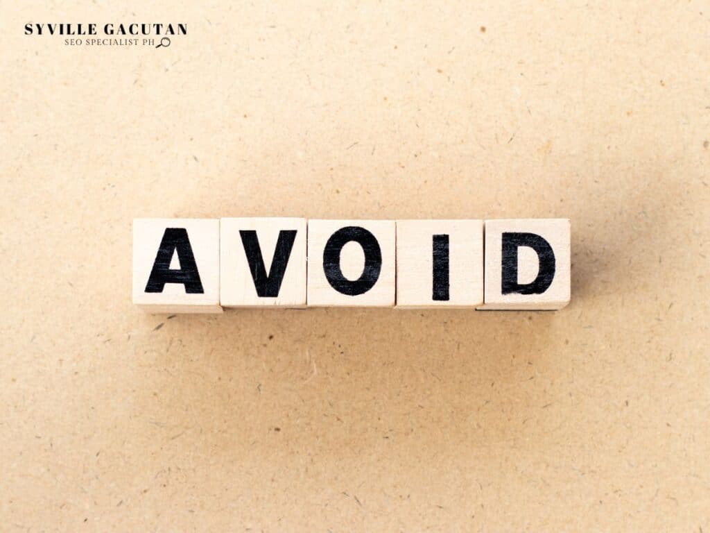 Wooden letter tiles spelling "AVOID" on beige textured background.