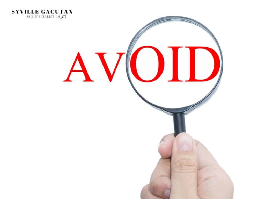 A magnifying glass highlighting the word "AVOID" in red text against a white background.