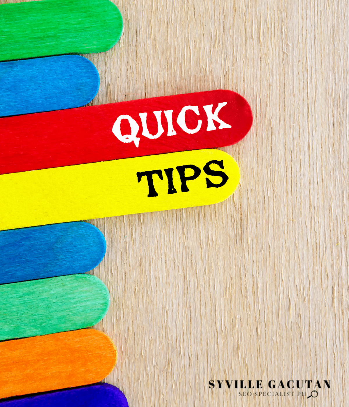 A colorful popsicle sticks arranged vertically, with "QUICK TIPS" text in red and yellow sticks.