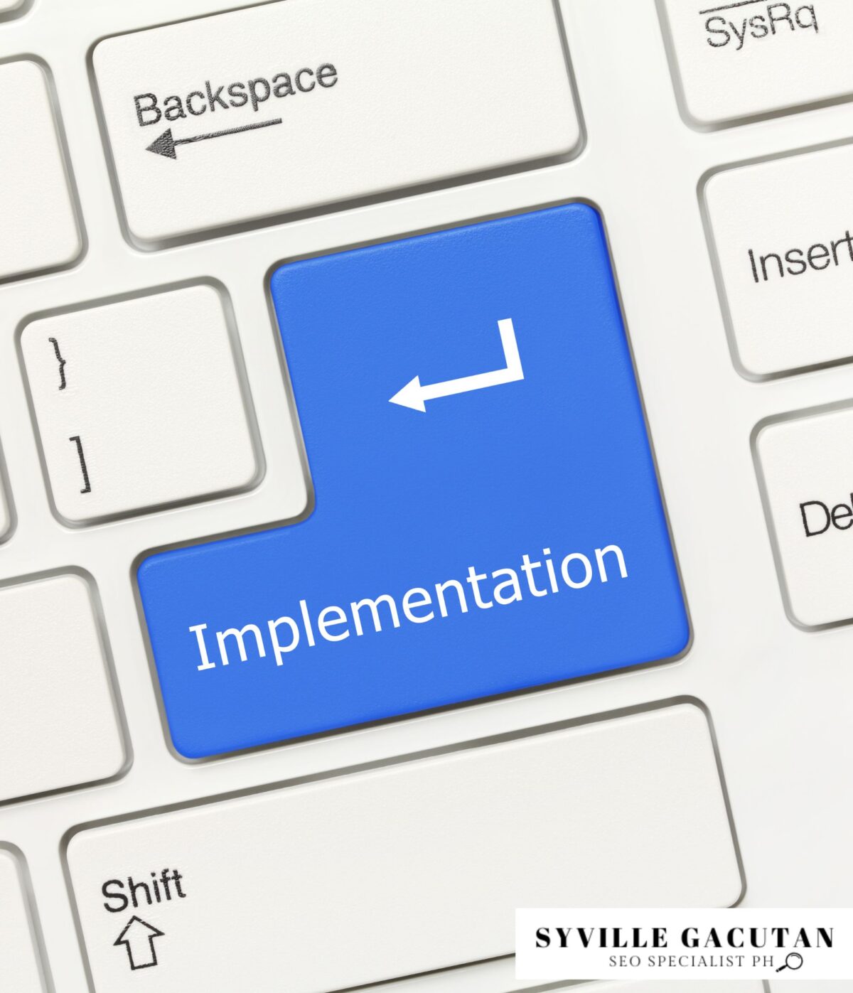 A blue keyboard key labelled "Implementation" for focus and execution.