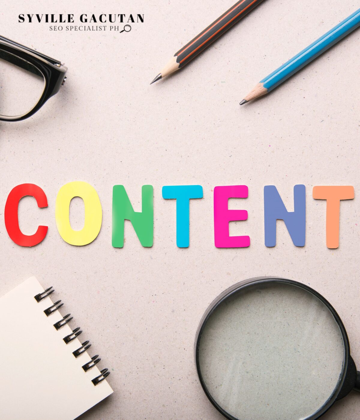 "CONTENT" in colourful letters surrounded by stationery tools on a desk.