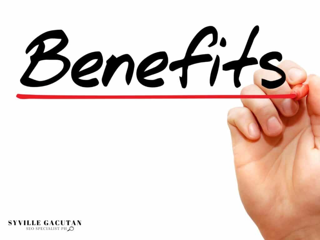 Hand writing "Benefits" in black marker, underlining it with a red line on a white surface.