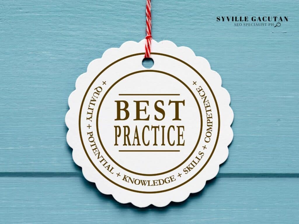 A white scalloped badge with "BEST PRACTICE" text hanging by red string against blue background.