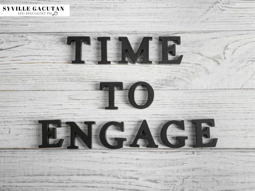 Black 3D letters spelling "TIME TO ENGAGE" on white wooden textured background.

