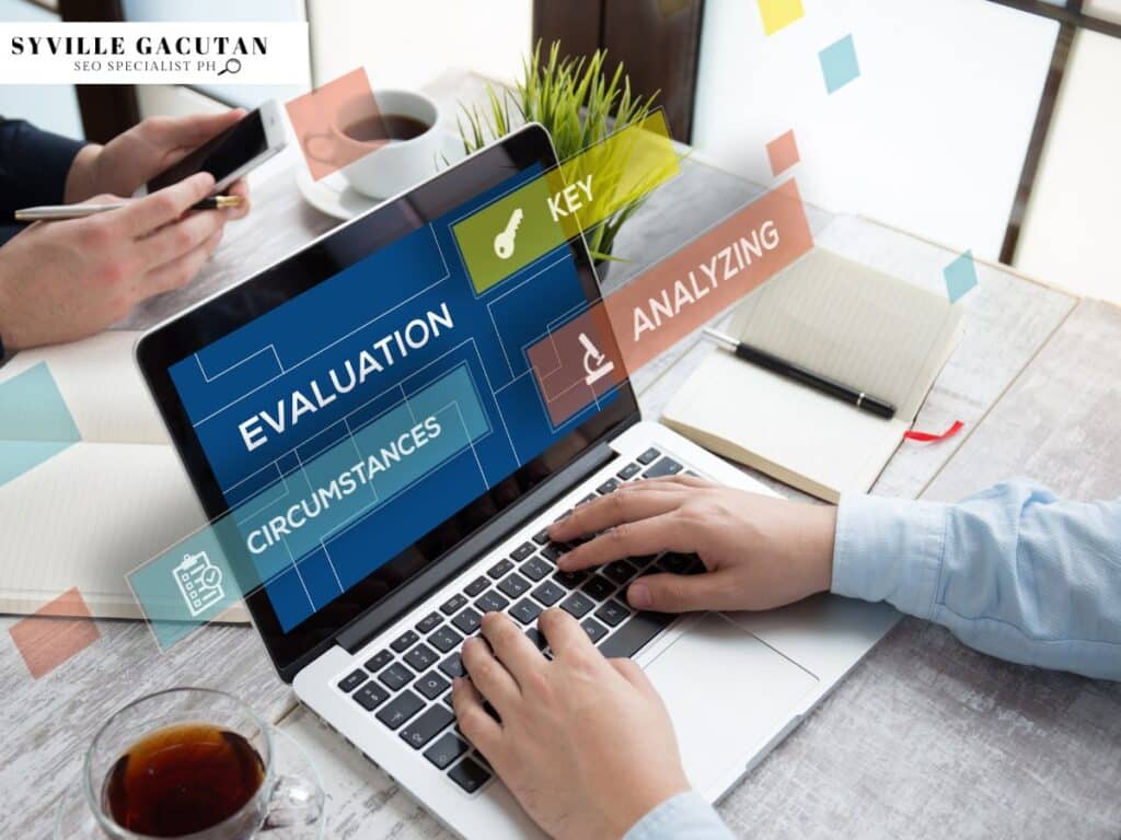 Laptop screen displaying "Evaluation" flowchart with key analysis terms at workspace with coffee.