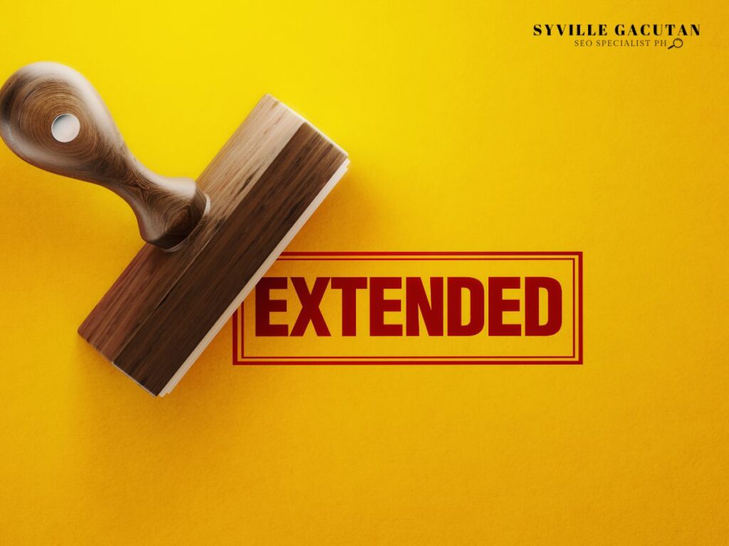 Wooden stamp with "EXTENDED" text in red on vibrant yellow background.