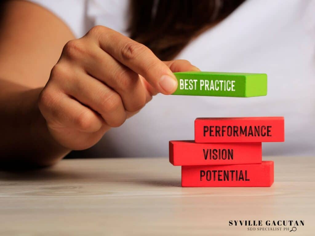 Hand stacking blocks labeled "Best Practice," "Performance," "Vision," and "Potential."