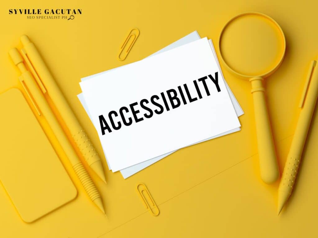 "ACCESSIBILITY" text on white paper with yellow office supplies and magnifying glass.