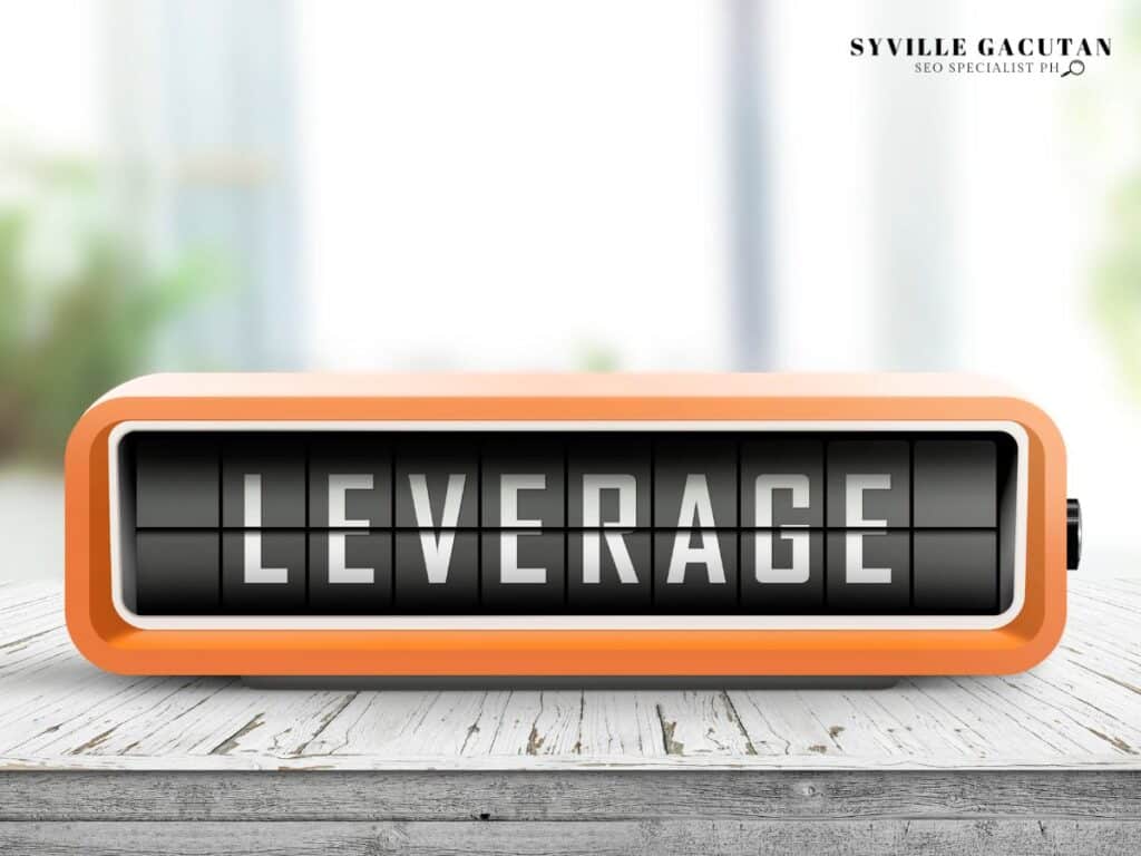 Orange digital display board showing the word "LEVERAGE" in flip-clock style lettering.