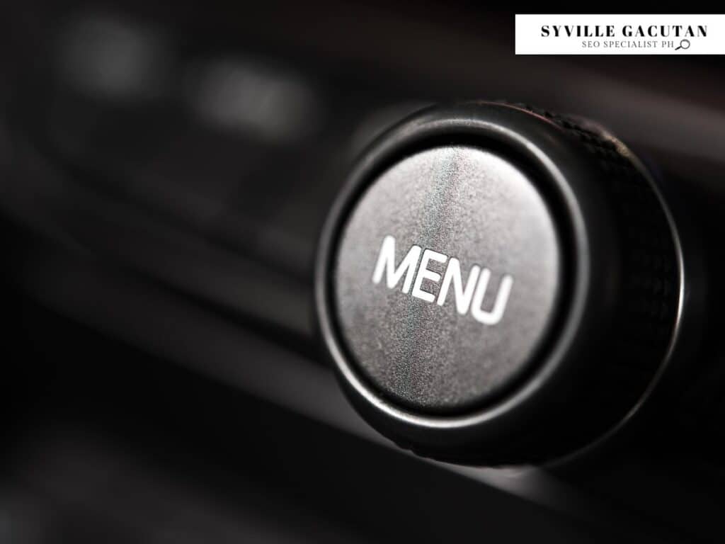 Black knob with the word "Menu" engraved on it.