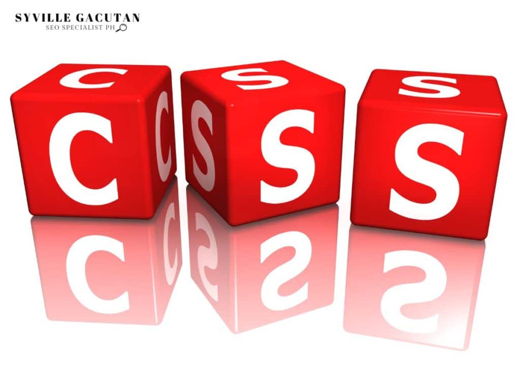 Red 3D blocks spelling "CSS" with mirrored reflection on glossy surface.