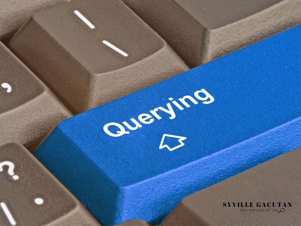 Blue "Querying" key on keyboard with arrow icon, surrounded by gray keys.