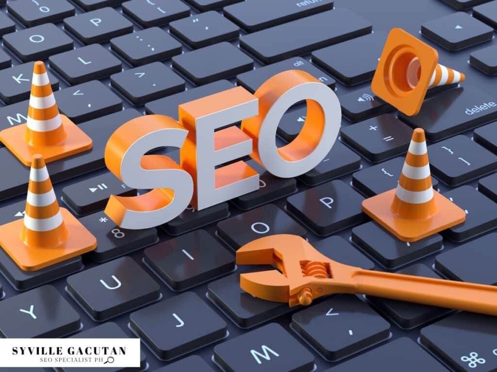 3D "SEO" text with orange traffic cones and wrench on computer keyboard.