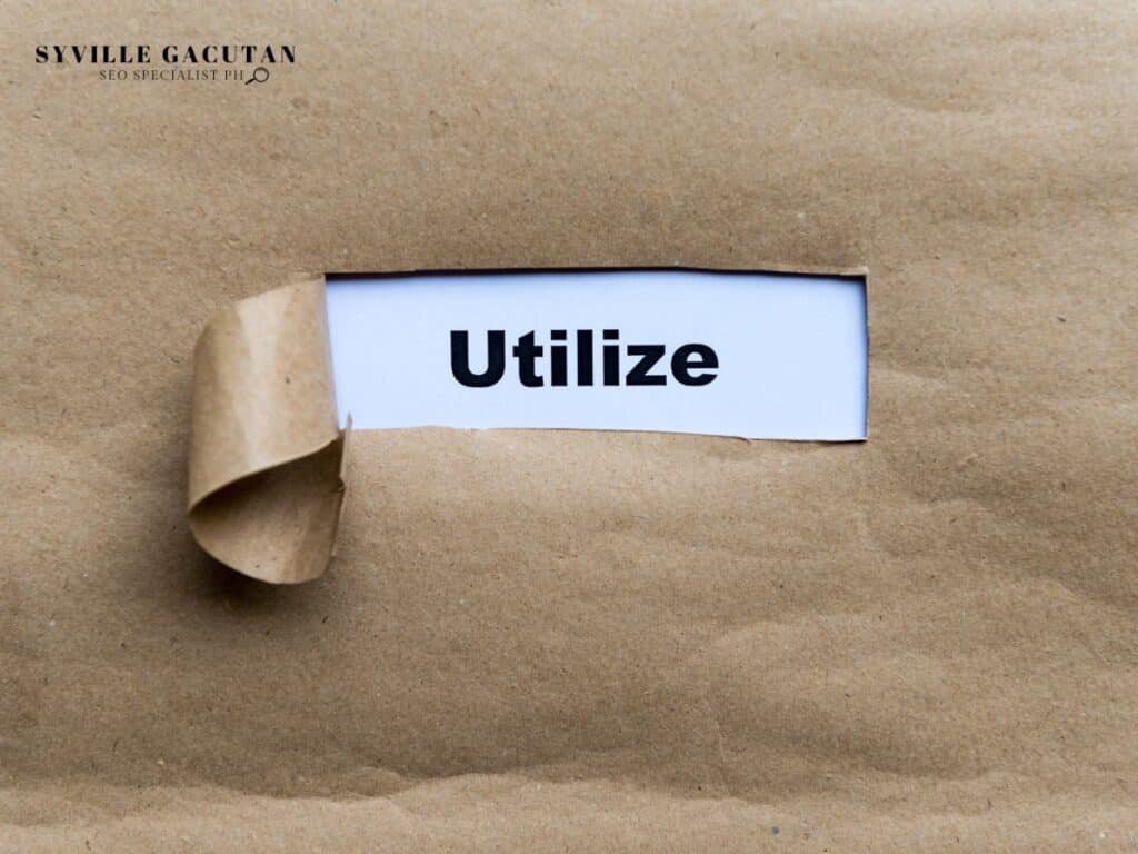 Partially revealed text 'Utilize' on a brown paper envelope.