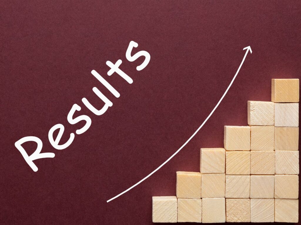 Results growth graphic with rising arrow and wood blocks.