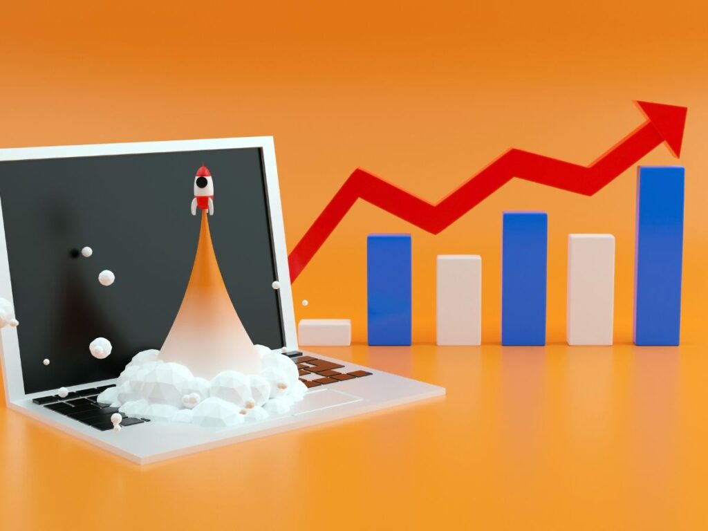 Rocket launching from laptop beside rising chart and arrow.