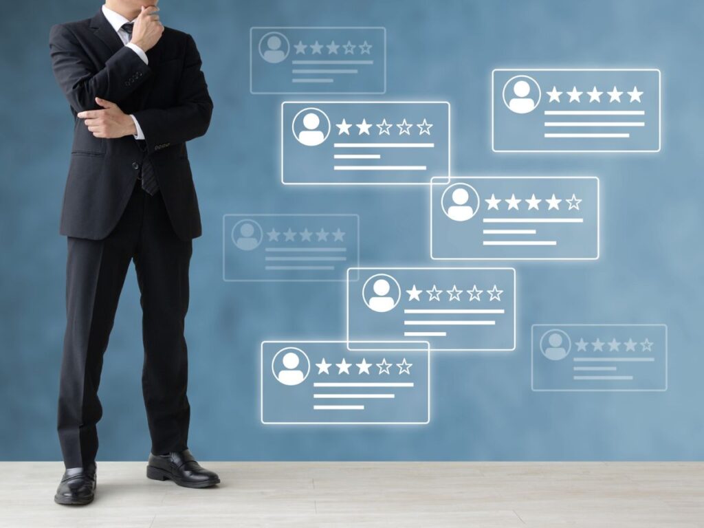 Businessman viewing floating customer review ratings.
