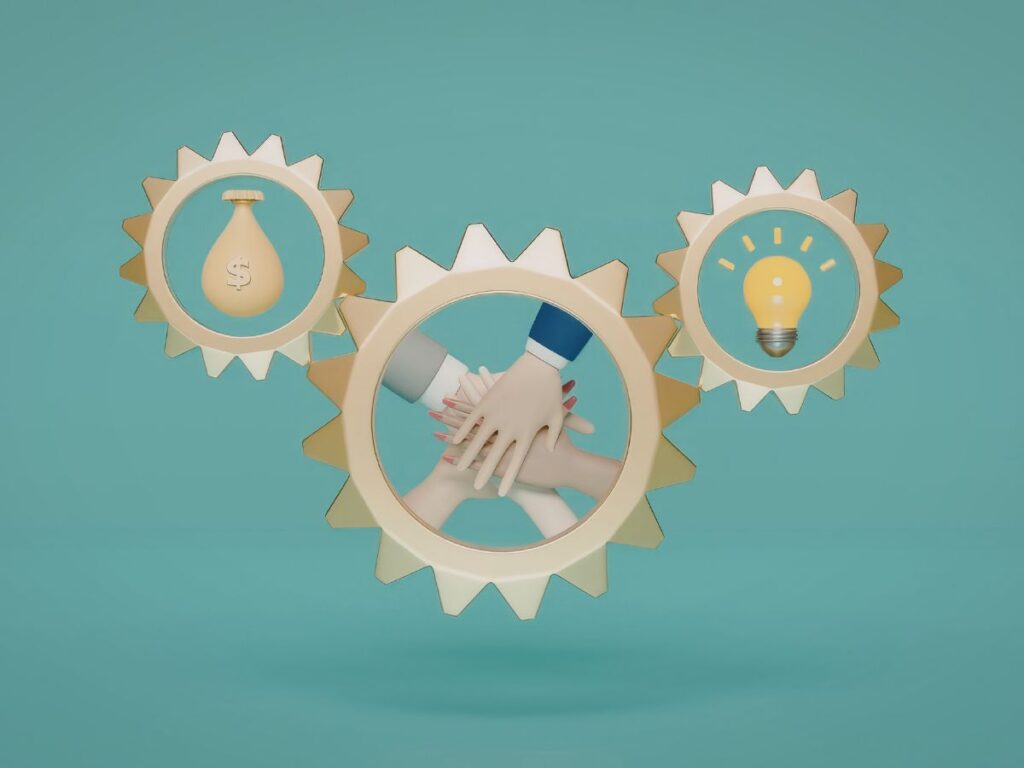 Team hands stacked inside gear icons.