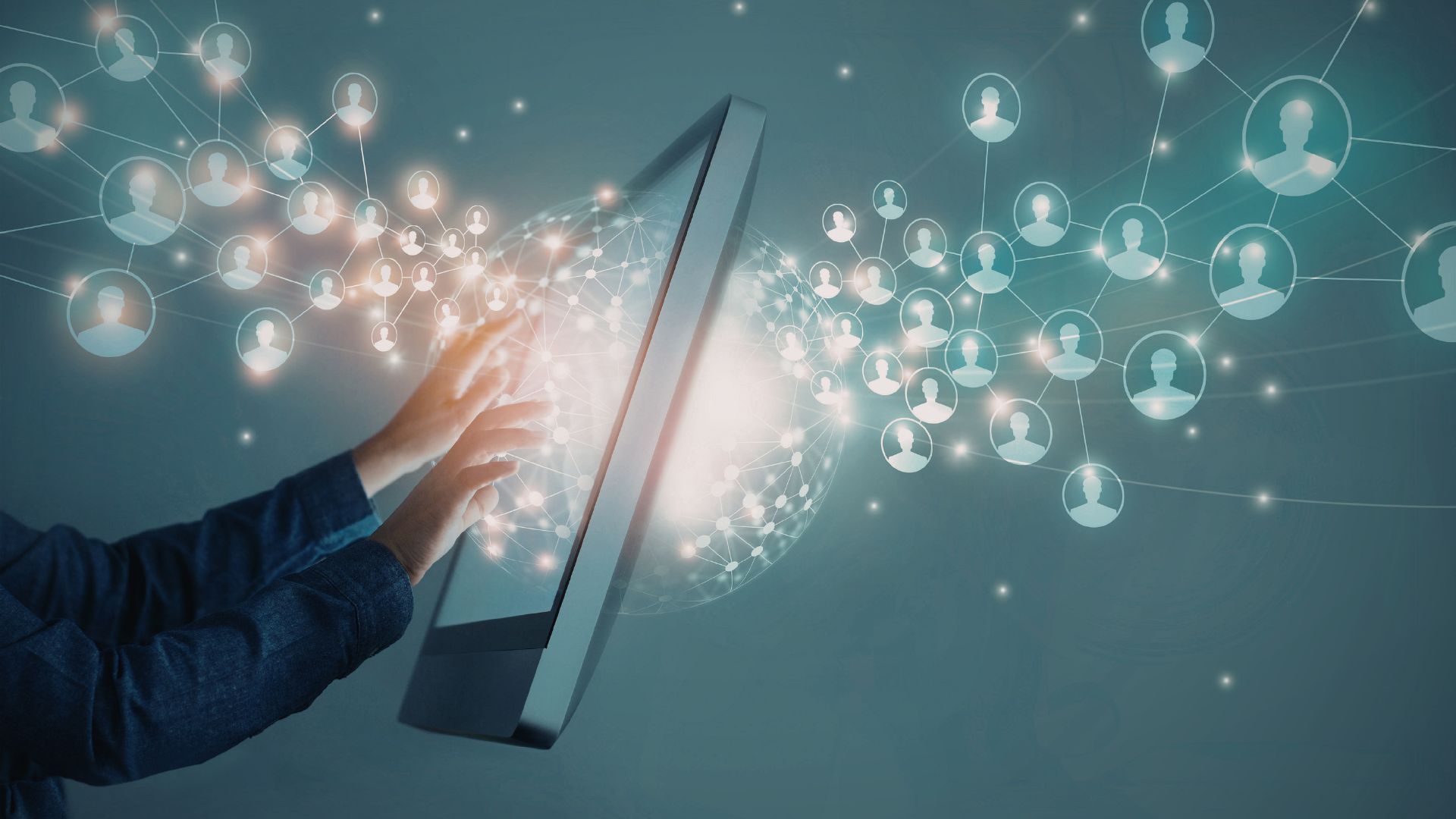 Hands touching a digital network screen.