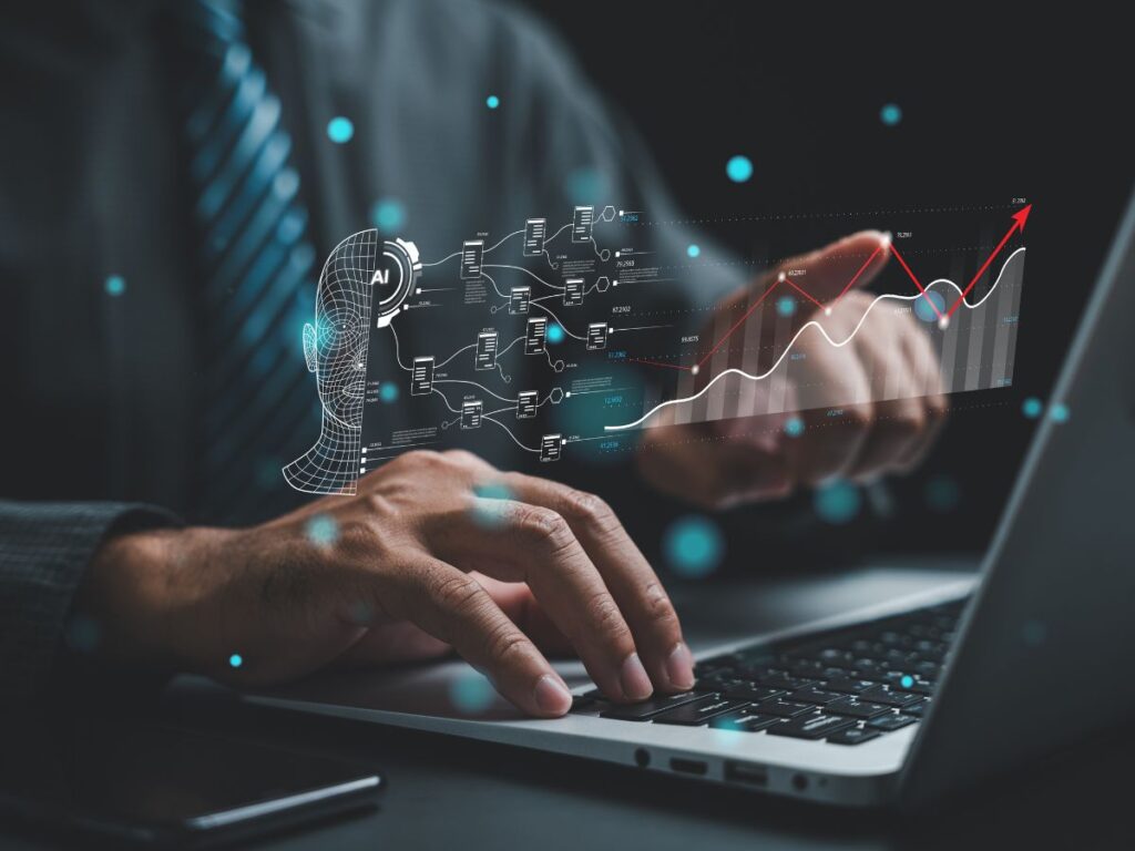 Person typing on laptop with AI graphics and rising chart overlay.