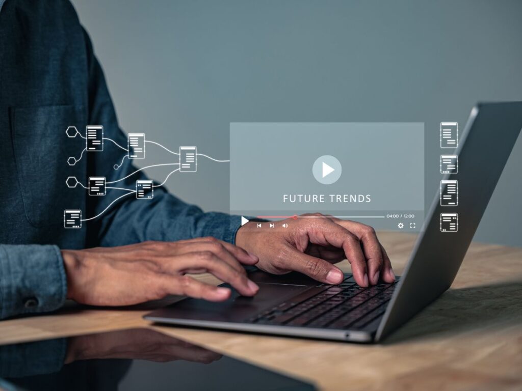 Laptop showing future trends video and content icons.