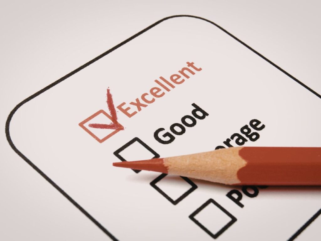 Pencil marking an excellent rating on a checklist