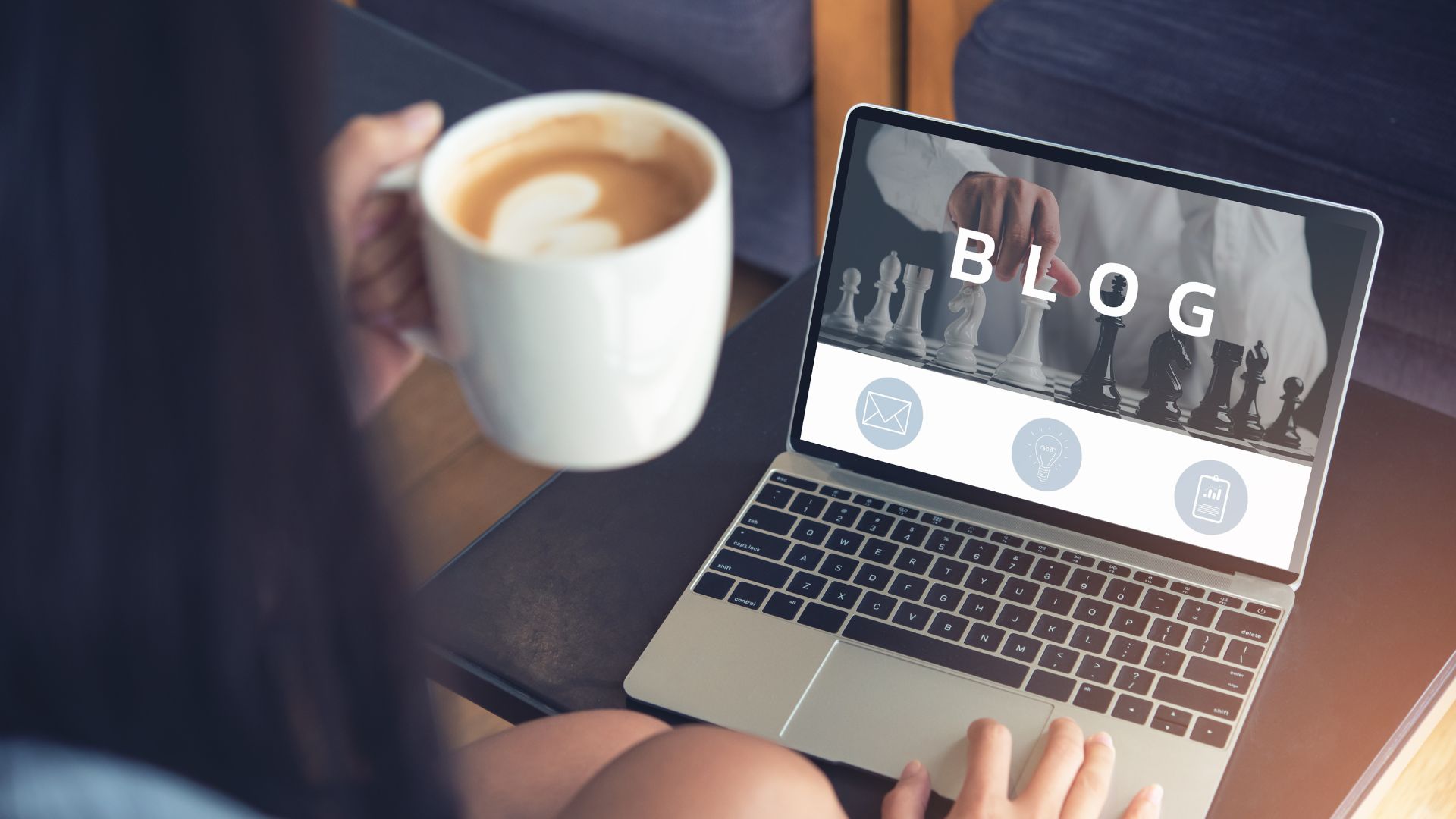 Person browsing a blog page on a laptop with coffee.