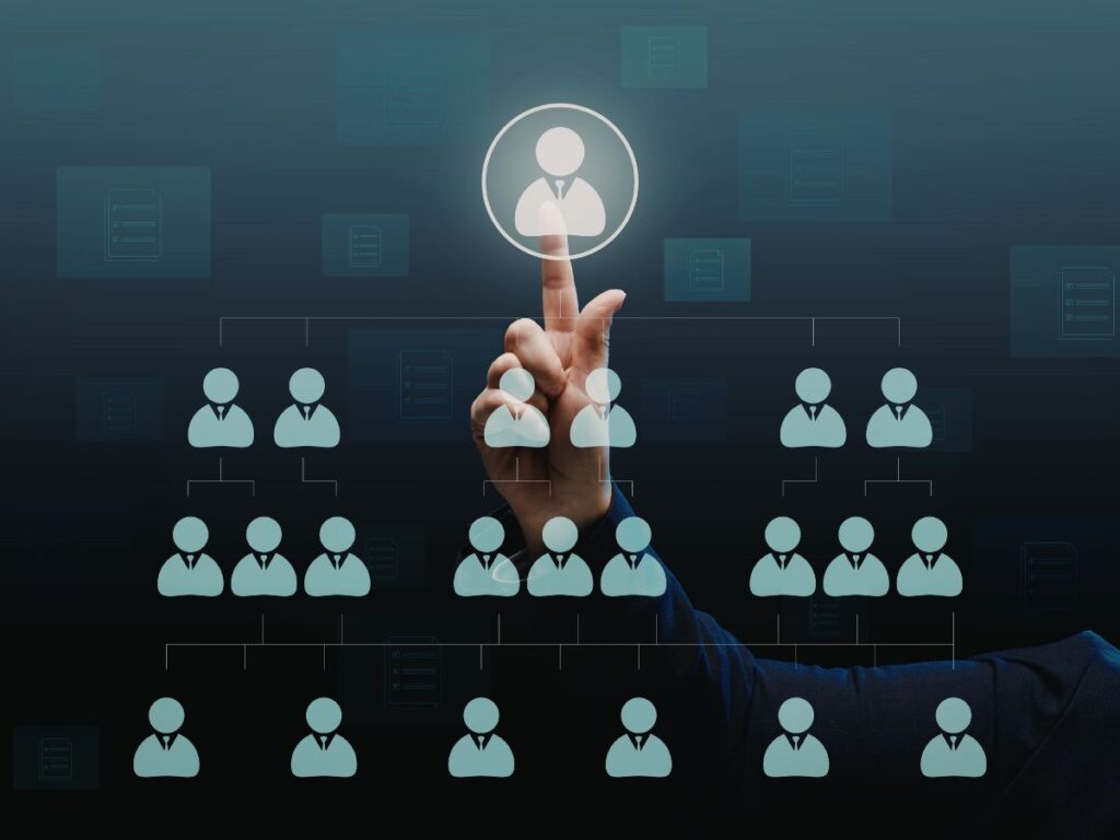 Finger selecting a profile in an org chart.